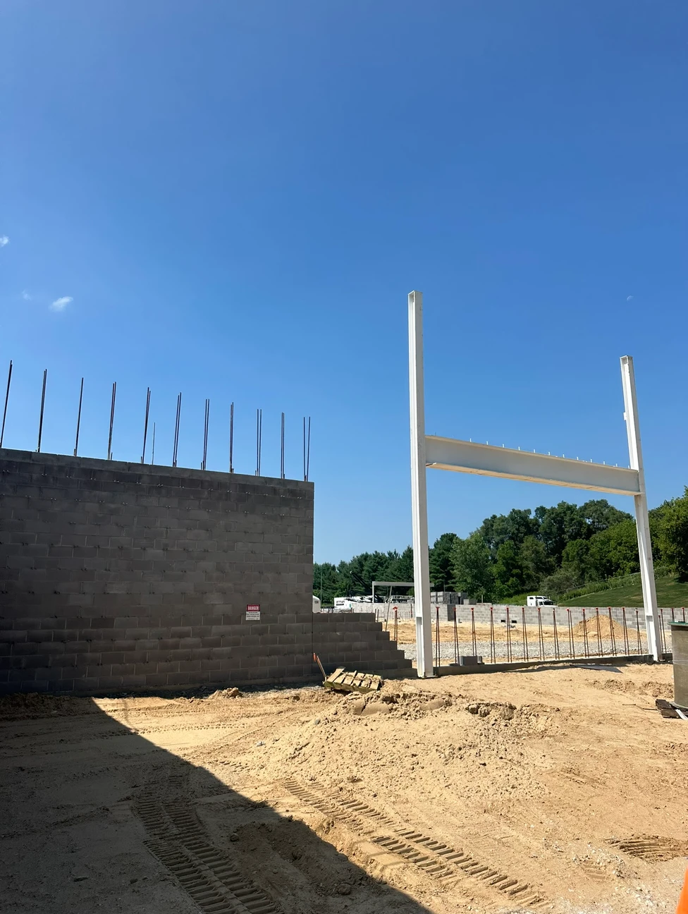 Construction progress outside, walls being built up