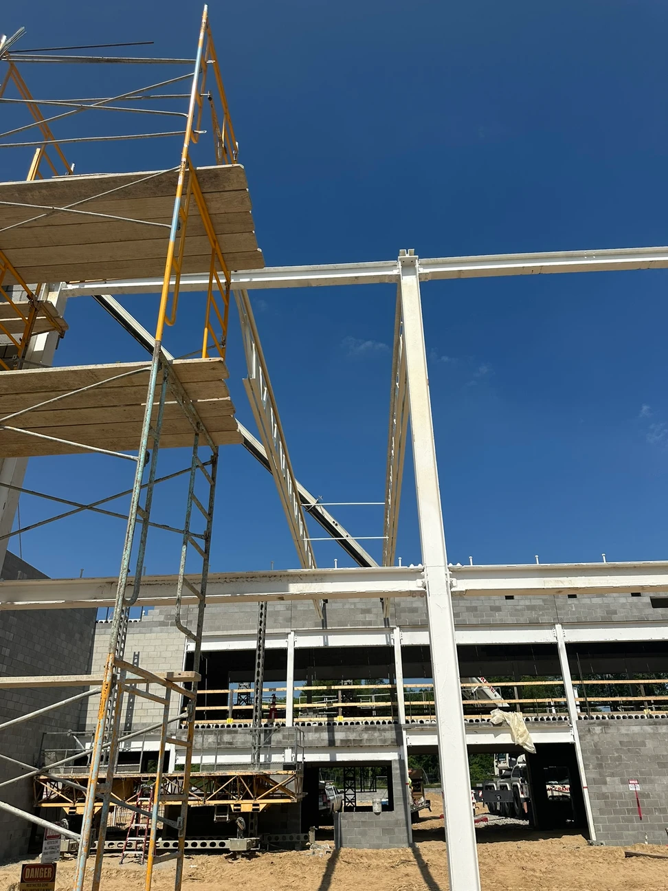 Construction progress outside, framing being built on
