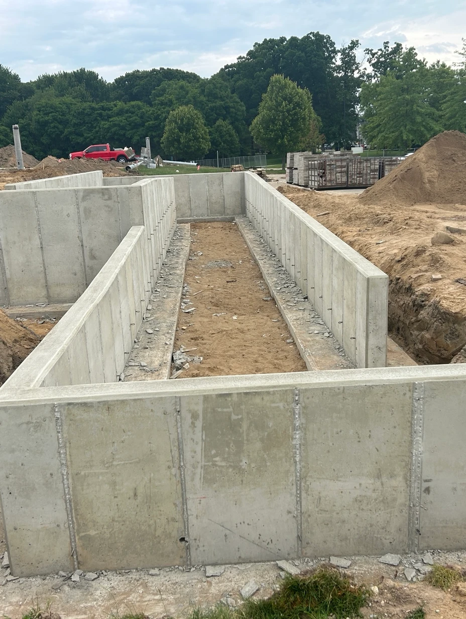 Concrete foundations being put in place outside