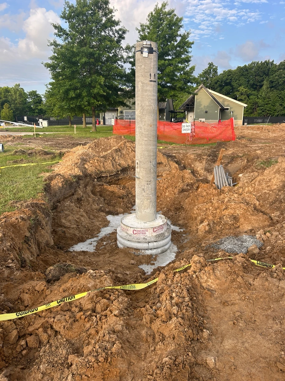 Construction progress outside, a large concrete pillar