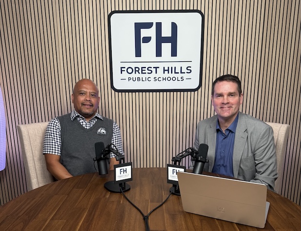 The superintendent and a male northern staff member ready to record a podcast